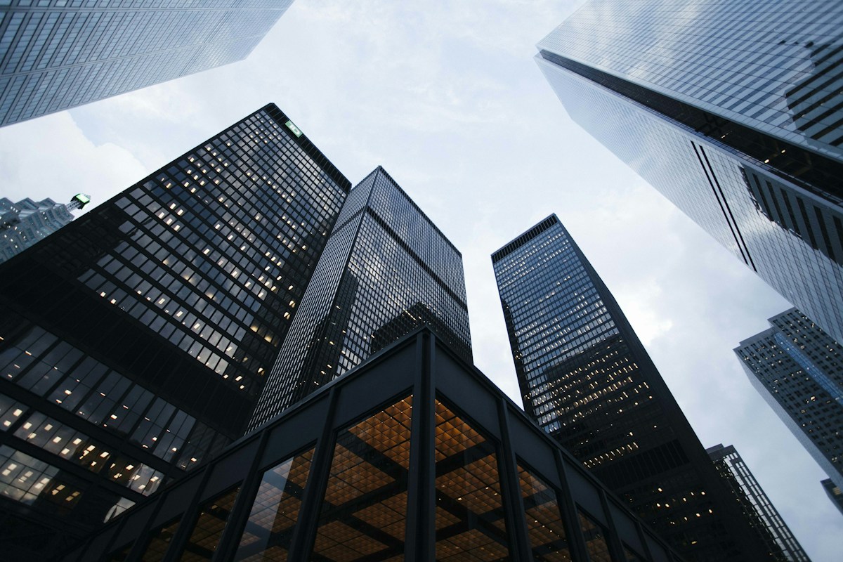 Looking up at the geometric lines of a modern office tower